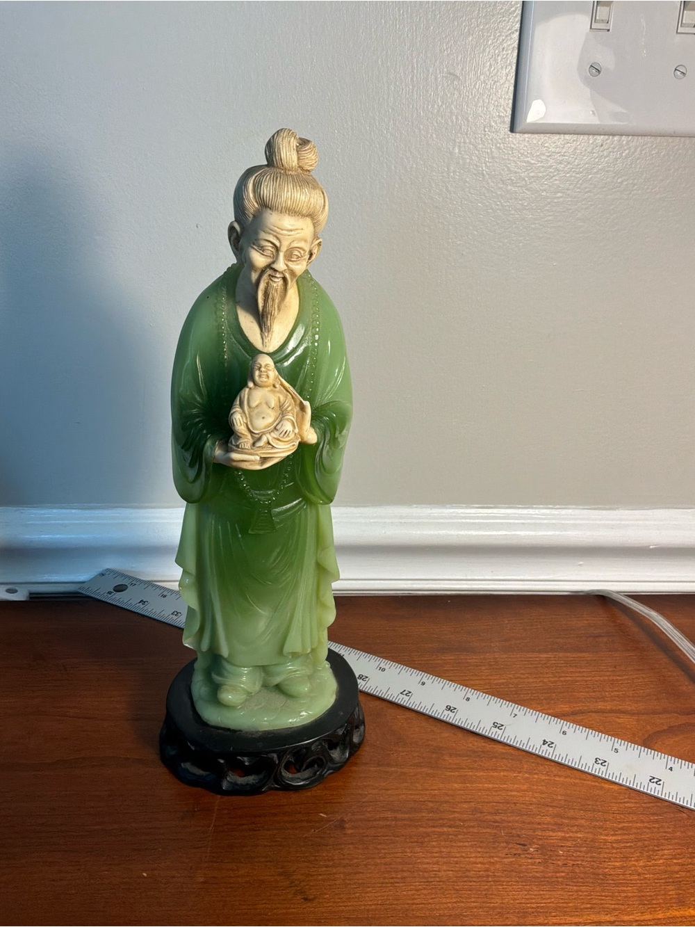 Vintage Emperor Chinese Figurine holding miniature statue of Buddha faux Jade